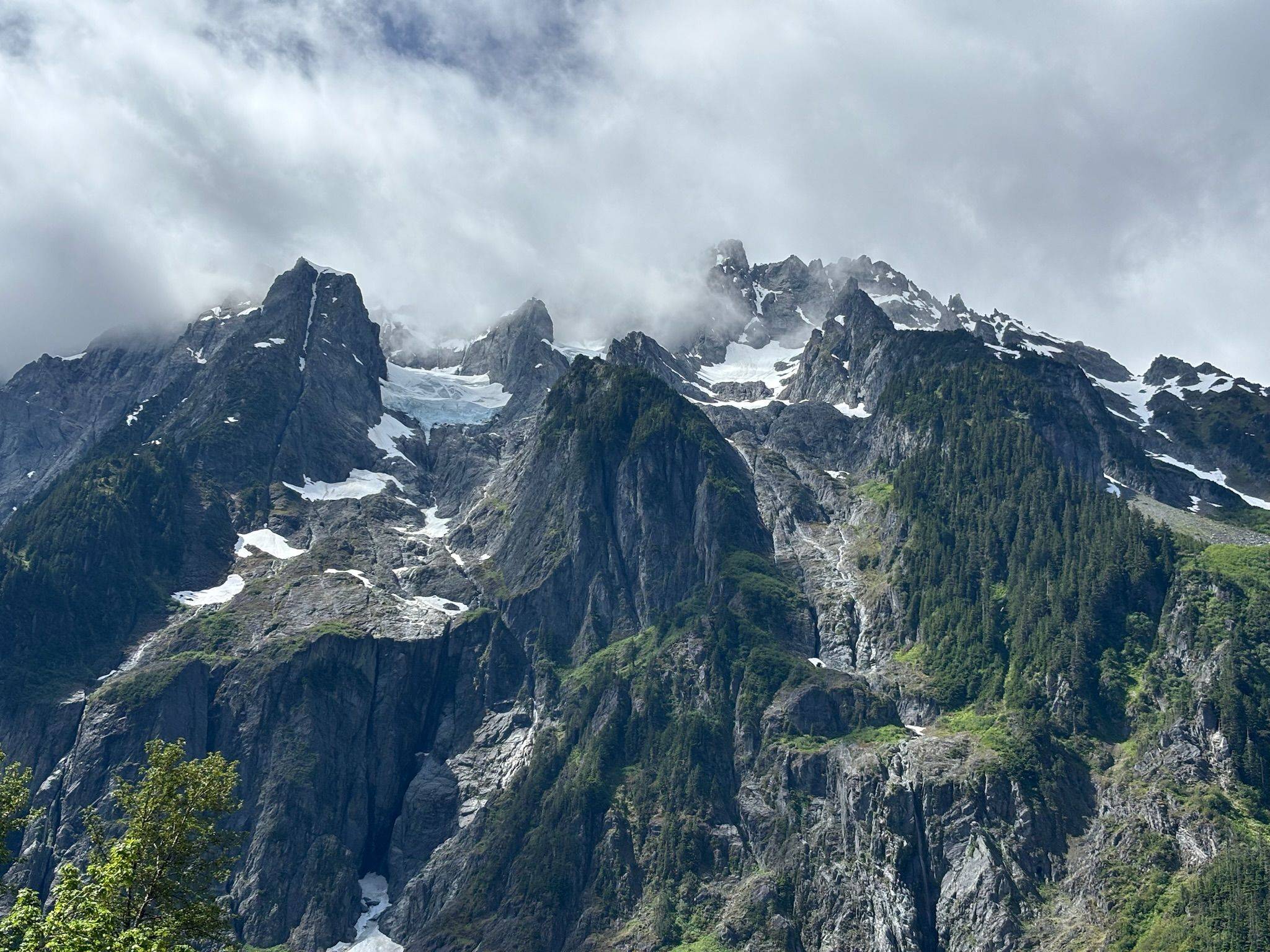 Snow-streaked peaks in low cloud
